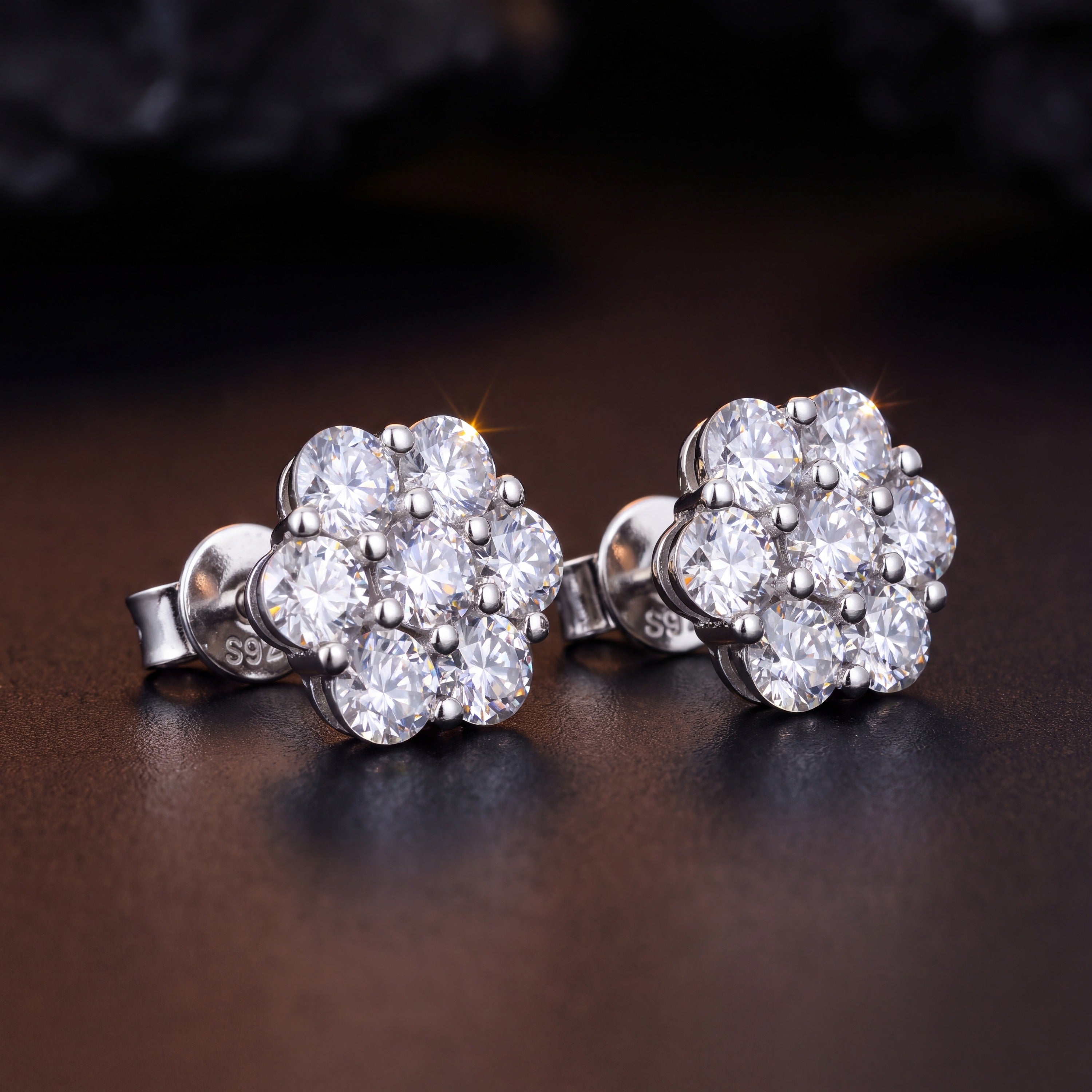 Pair of 7.2 mm moissanite flower cluster stud earrings in 925 sterling silver